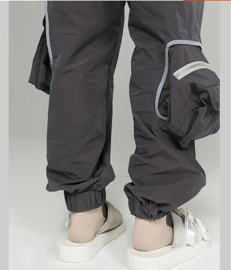 Multi-pocket loose tooling closing beam pants