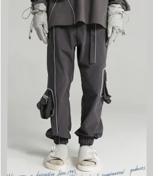 Multi-pocket loose tooling closing beam pants